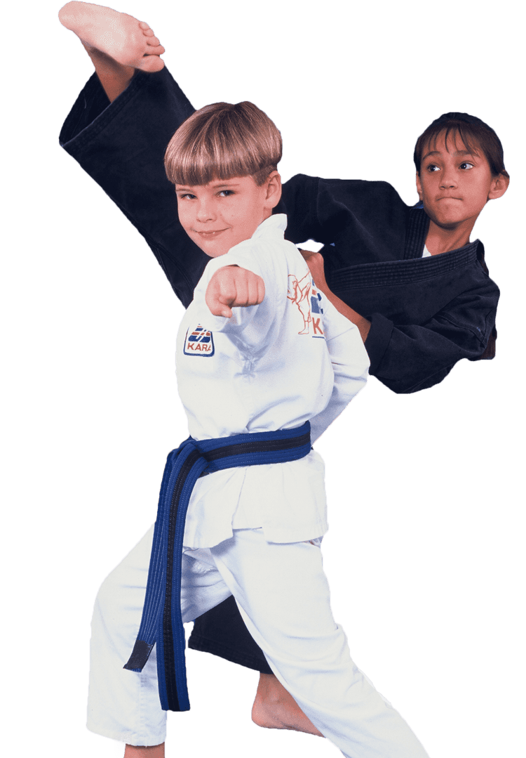 young girl kicking behind young boy